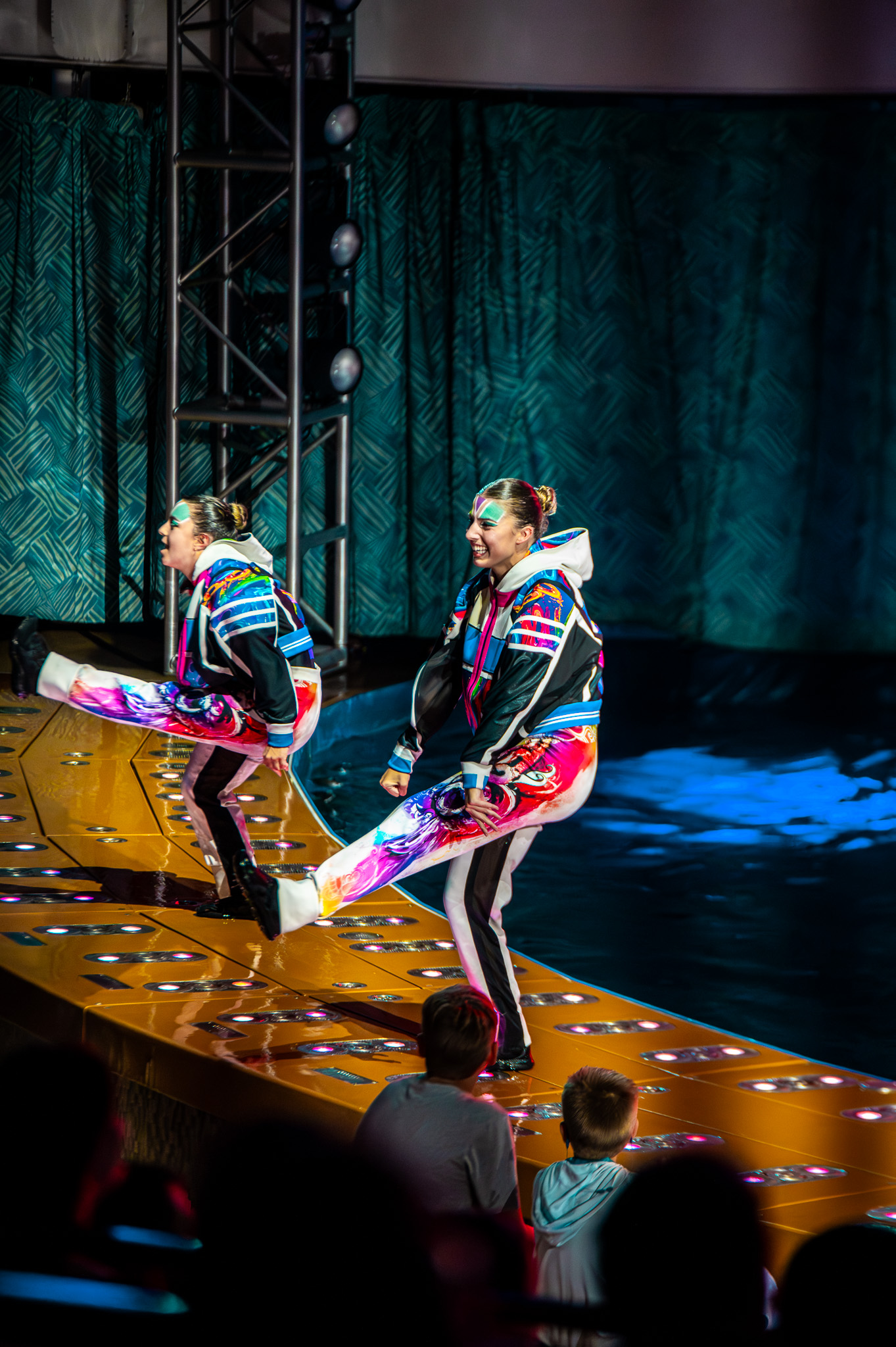 Group choreography in water with bright stage color