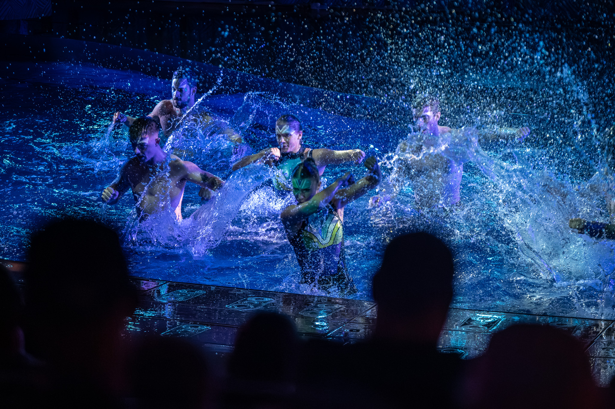 Water splash frozen around a performer during a live show